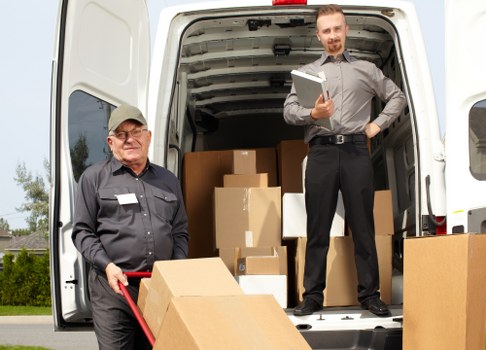 Moving team sorting recyclable packing materials during a house move