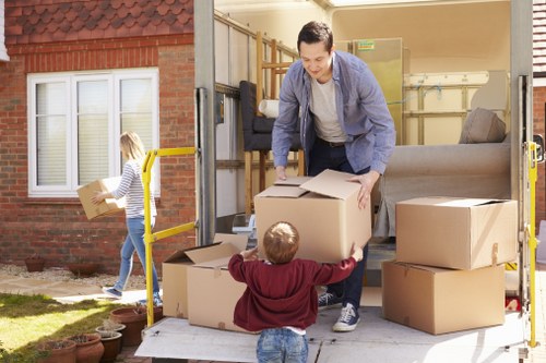 Furniture and packed boxes ready for a house move with removal service support