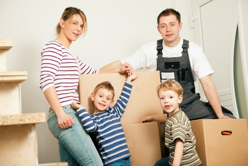 Organised home office relocation with labelled boxes and equipment