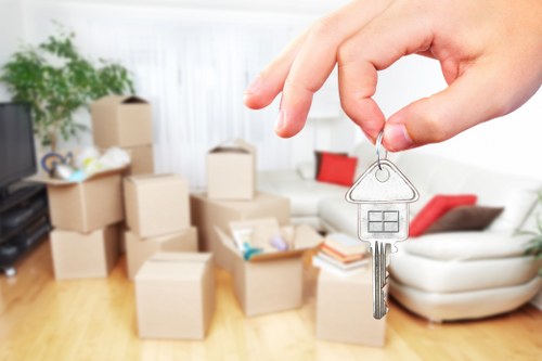 Removal team planning a local house move with boxes and furniture