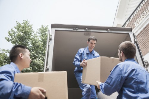 Packed business equipment and office furniture ready for transport
