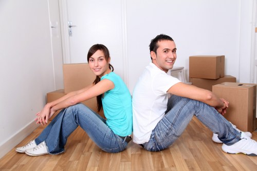 Packed moving boxes and wrapped household items ready for transport