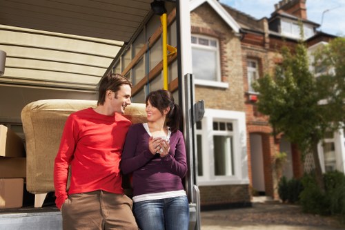Removal van positioned outside a house for an office move