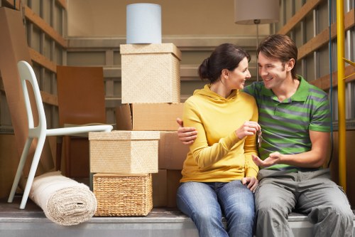 Local moving van loading household furniture for a house relocation