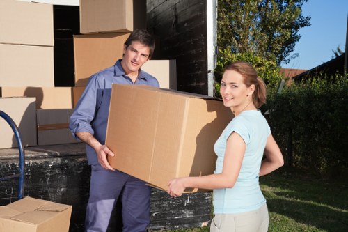 Removal team handling packing and bulky items for a home move