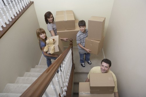 Removal crew transporting large furniture and appliances for a home move